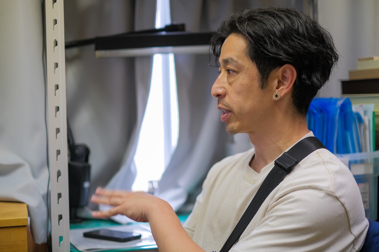 Mark Tanaka speaking in a quiet indoor space